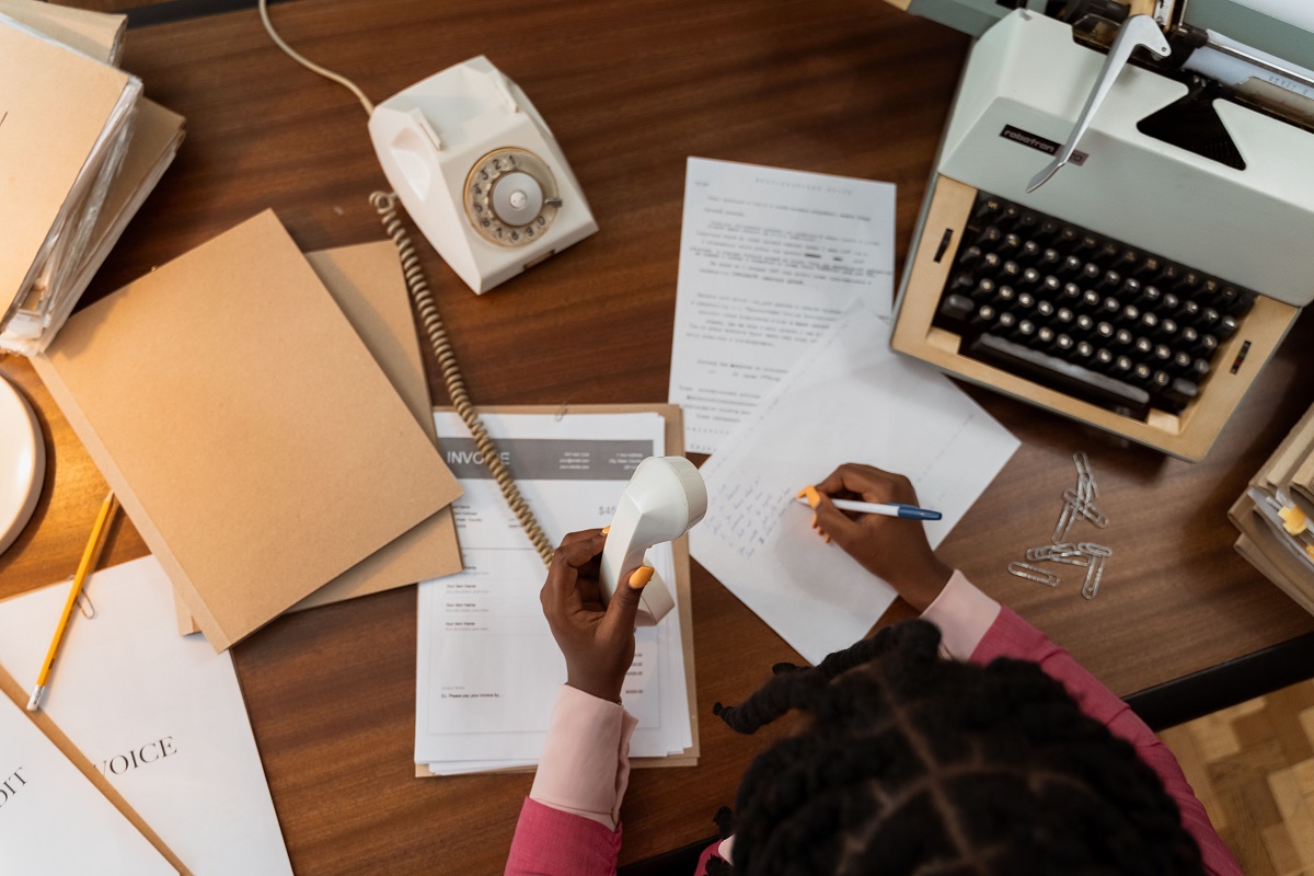 Define debtors and creditors: small business owner checking unpaid customer invoices and supplier bills