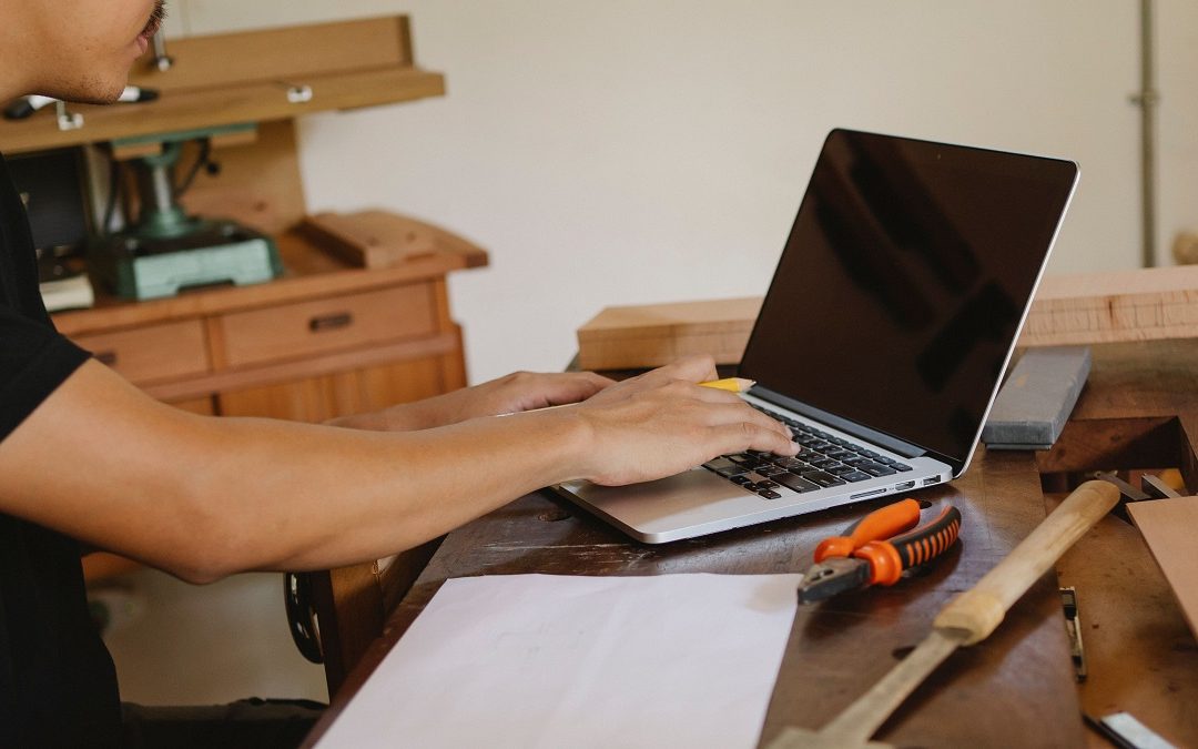 Private and limited company FAQs: small business owner checking company details on a laptop