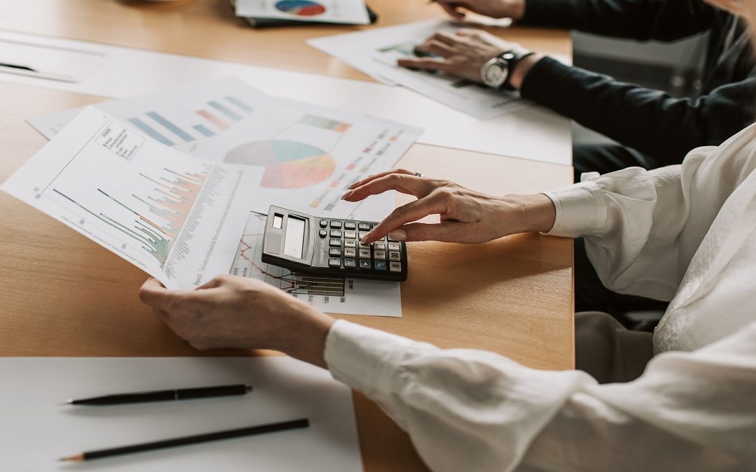 Corporate tax management records for a small limited company: receipts, invoices and bank statements on a desk